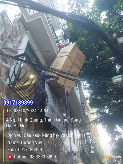 Dịch vụ kéo chuyển máy giặt tủ lạnh lên nhà cao tầng bằng tời điện tại hà nội